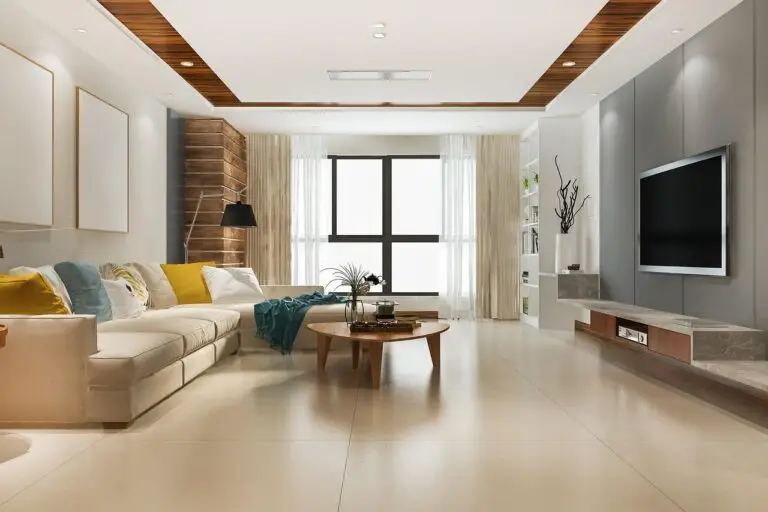 salon moderne dans un appartement avec canapé luxe beige et une grande tv et une table basse
